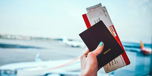 Ticketing Cropped shot of an unrecognizable woman holding up her passport and plane ticket before boarding her aircraft